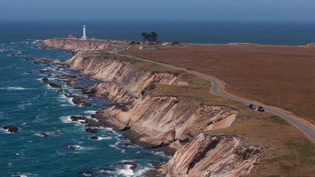 Aerial views show Point Arena Lighthouse along the northern California coast near Mendocino and the surrounding ocean.