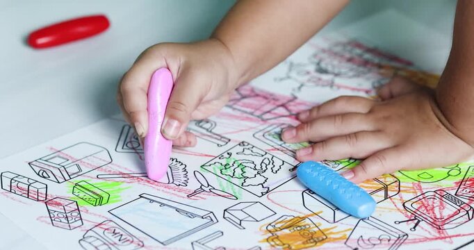 Child coloring with crayons on paper, promoting creativity, imagination, early learning, artistic development, fine motor skills, and joyful childhood education, close-up