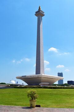 Jakarta, Indonesia, October 26, 2024 - Monas National Monument in Jakarta, Indonesia, with modern skyscrapers in the background