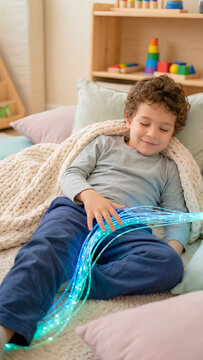 Child with sensory processing disorder using fiber optic lights for calming therapy in a clinical or home environment