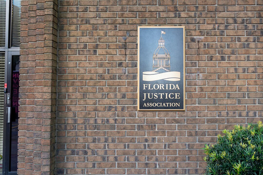 
Tallahassee, Florida,  USA - February 11, 2022: The sign for the Florida Justice Association (FJA) on the building on S Monroe St in Tallahassee, Florida,  USA.
