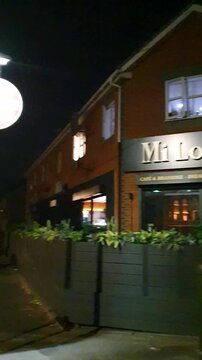 Low Angle Illuminated Streets View of Luton City of England United Kingdom After Sunset Night. Wide Angle Camera Footage Was Captured During Walk at Night of June 27th, 2026. 