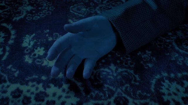 Man Knocked Out Or Collapses On Carpet In Dark Room

