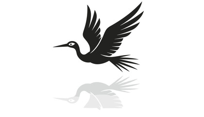 Obraz premium Elegant black silhouette of a flying stork bird soaring with outspread wings and its soft grey shadow reflection below.