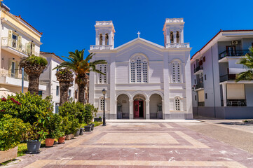 Fototapeta premium A view across the Filellinon Square towards the Saint Nicholas Church in Nafplio in Greece in early summertime