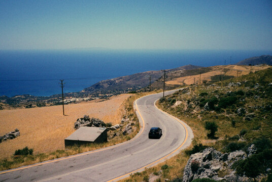 Black car on the road in Greece 