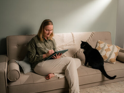 Woman working at home using digital tablet 