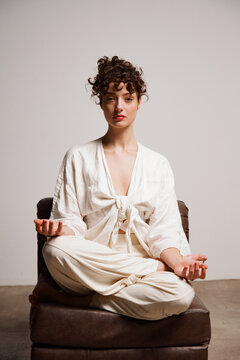 Meditation Session in a Studio Space With Soft Lighting