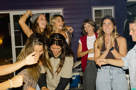 UGC Girls friends laughing together at backyard birthday night party