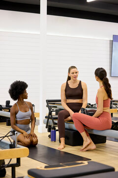 Friends Practice Together on Pilates Reformer