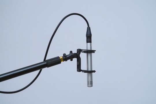 close up of a microphone on boom pole