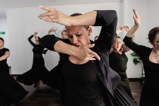 Flamenco dancer expressing passion through traditional movement