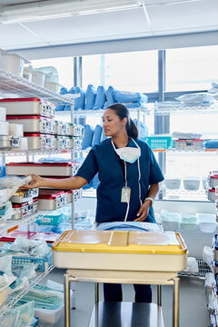 Nurse Organizes Clinic Supplies