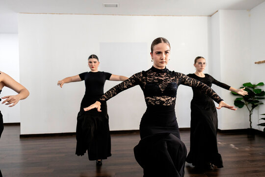 Female flamenco dancers performing in dance studio