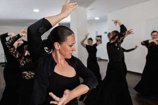 Flamenco dancers practicing traditional spanish dance in studio
