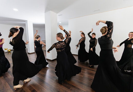 Women learning traditional spanish flamenco dance moves