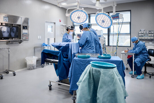 Surgeons Prepare for Operation in Modern Surgical Room