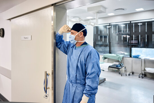 Exhausted Surgeon in blue scrubs 