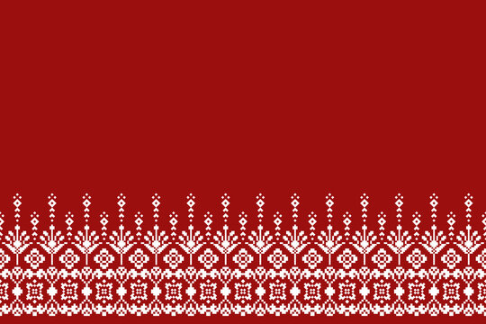 Intricate white geometric ornamental border along the bottom edge of a vibrant red background with spacious negative space for elegant design applications.