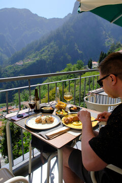 Man Dining on Terrace Overlooking Curral das Freiras, Madeira
