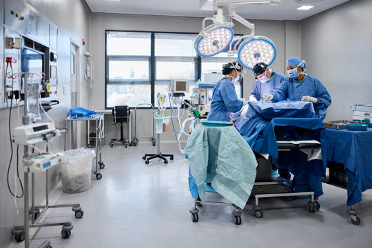 Medical professionals performing surgery in a modern operating room