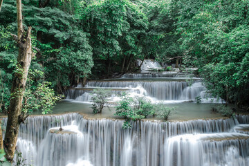 Erawan Waterfall Multi Tier Cascades in Lush Tropical Forest Thailand © Pornsak