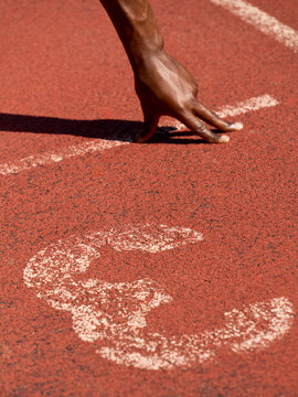 Runner Starts Race on Track at Sports Event