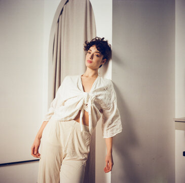 Model Poses in Modern Indoor Space During Daylight
