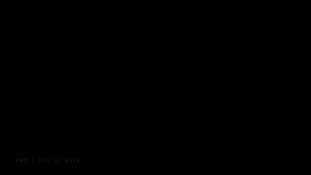 A completely black background image with a subtle texture suitable for graphic design.