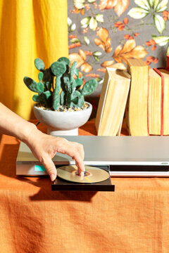 Inserting a CD disc into a DVD player