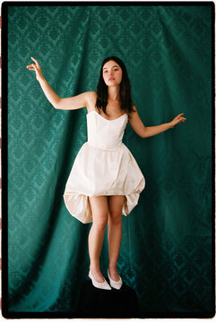 Woman posing in white dress