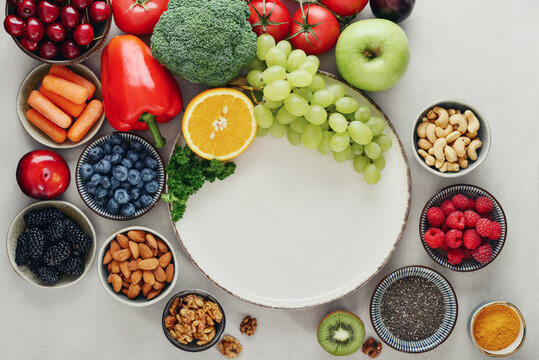 Healthy antioxidant rich foods flat lay on light background with copy space