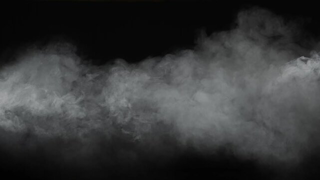 White smoke drifts across a black background creating a dramatic abstract composition with copy space. Concept of fog, mystery, atmosphere, cinematic effect, overlay, design, and visual background.