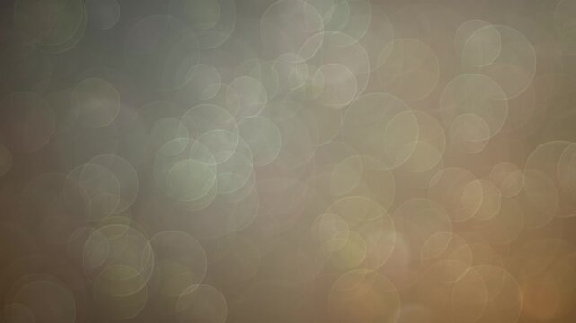 A dark background with soft, luminous bokeh lights creating an abstract and artistic visual effect