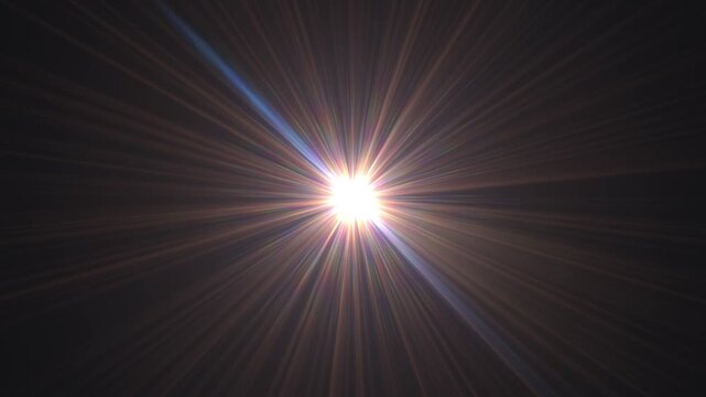 An intense burst of light with radiating sun rays against a dark night sky