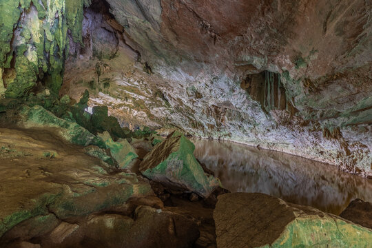 Ba Be cave interior with underground lake and rock formations, Vietnam