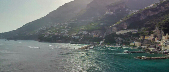Fototapeta premium Cinematic aerial view of Amalfi coastline and historic