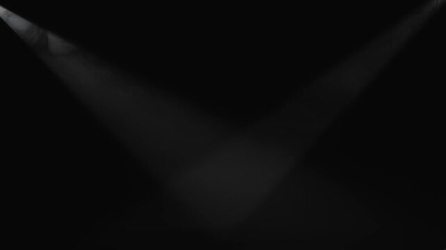 Two white spotlights cross through dense smoke against a black background. Concept stage, theater, concert, cinema, event, advertising, design, and dramatic overlay visual effects.