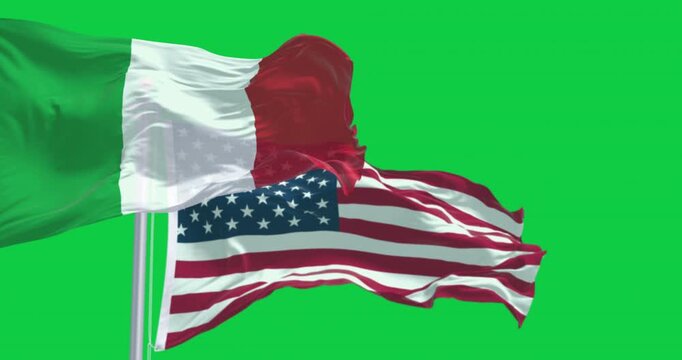Flags of Italy and US waving in the wind isolated on green background