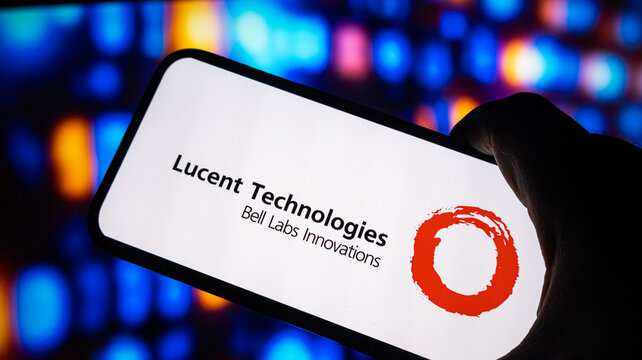 Lucent Technologies Bell Labs Innovations logo on smartphone screen bright abstract lights backdrop.