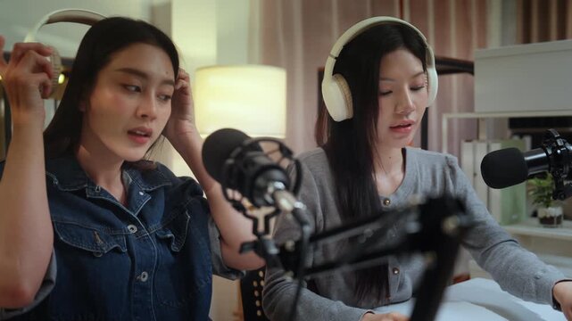Podcaster podcast content influencer creator recording microphone headphone studio duo speak with warm professional focus and creative energy for digital audience growth in calm session