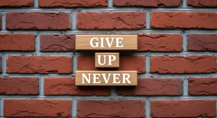 Fototapeta premium Inspirational Give Up Never Message on Wooden Blocks Against a Red Brick Wall Background