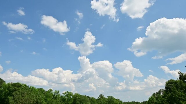 Time Lapse of Clouds Over Green Landscape