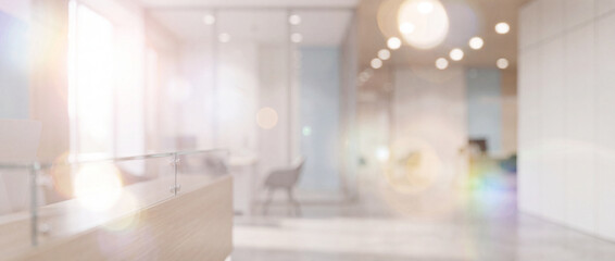 Fototapeta premium Blurred modern office reception interior background featuring soft bokeh lighting, warm neutral tones, glass partitions, and clean spacious design for corporate website banners