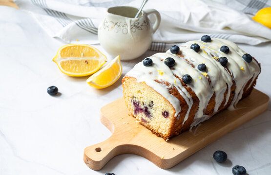 Sliced lemon pound cake decorated with blueberry