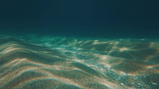 Underwater view of the sea and sandy beach near the island of Ilha Grande in Brazil