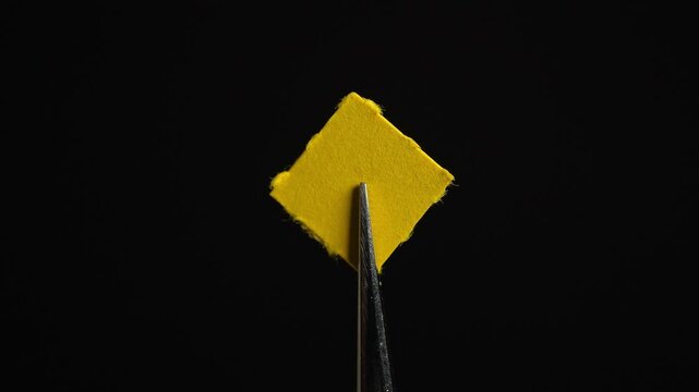 Tweezers with LSD acid blotter paper examination concept for health therapy research. Laboratory set, microdosing discovery and development. Mental health clinic trial treatment for PTSD depression.