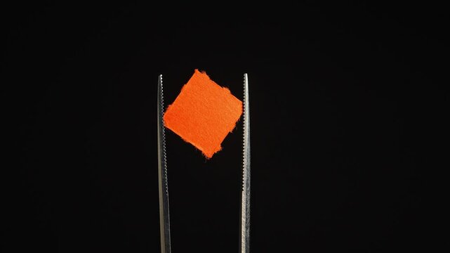 LSD blotter paper in lab setting as part of controlled psychedelic research including microdosing studies and clinical trials exploring LSD‑assisted therapy for conditions like depression and PTSD.