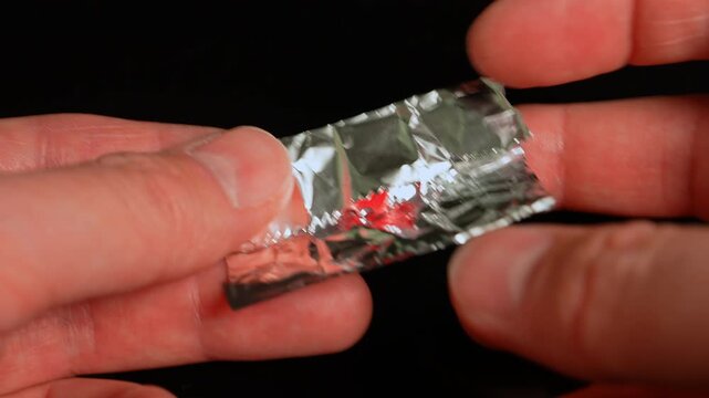 LSD acid wrapped in aluminum foil for storage and transportation. LSD usually distributed on small pieces of blotter paper. Dealers use foil as protective wrap. LSD possession distribution is illegal.