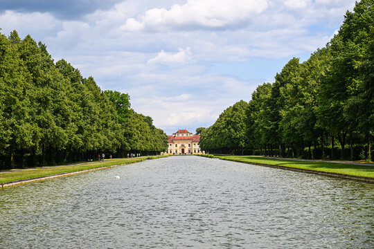 Baroque palace at the end of a tree-lined canal